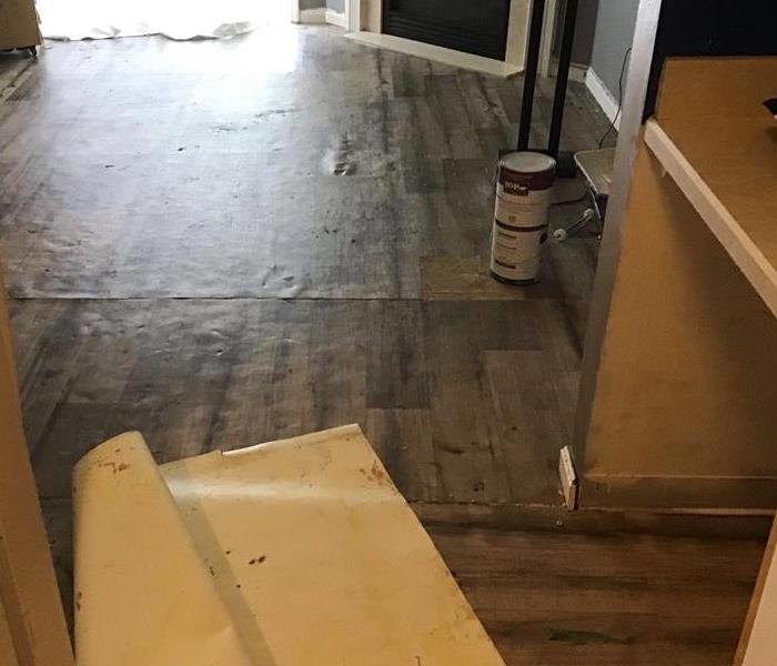 water damage on a wooden floor inside a house near Barberton/Norton, Ohio